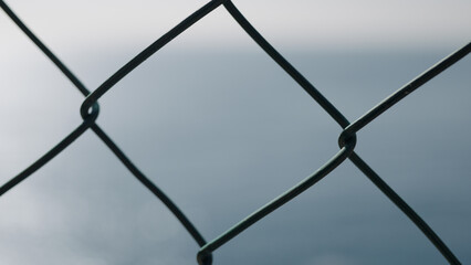 Closeup shot of a fence with blue sky background