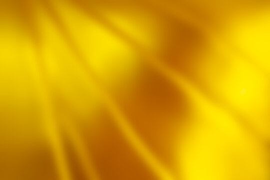 Blurry image of shiny surface on the golden buddha. Gold background for representation or template.