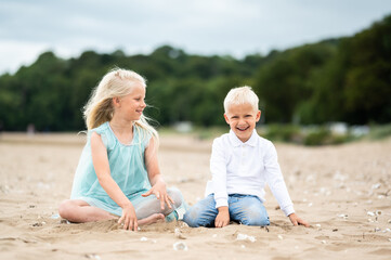 children playing on the beach, brother and sister