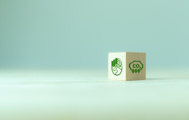 CO2 emission concept. Green business concept. Net zero emissions. Renewable energy, sustainability, ecology solutions. The wooden cubes with CO2 emission reduction and green community icon.