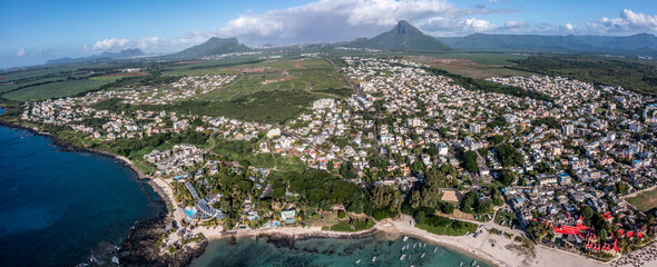 Flic en Flac, Mauritius - April 23, panoramic aerial landscape view of Flic en Flac area with cityscape of Flic en Flac, Beaches with boats in Water and Mauritius mountain landscape in the background
