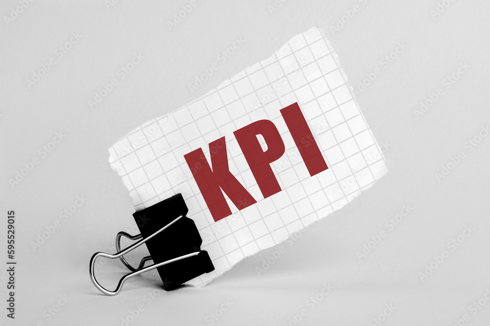 Poster piece of paper on a grey background with text kpi