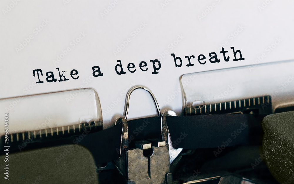 Poster text take a deep breath typed on retro typewriter