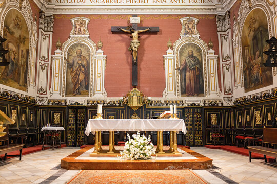 Huelva, Spain - April 22, 2023: Main Altar of the Parish Church of San Juan Bautista, Saint John Baptist, in Spain Square in the Municipality of La Palma del Condado, Huelva province, Andalusia, Spain