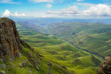 View from Lesotho's Sani Pass over the green foothills of the Drakensberg, South Africa - obrazy, fototapety, plakaty