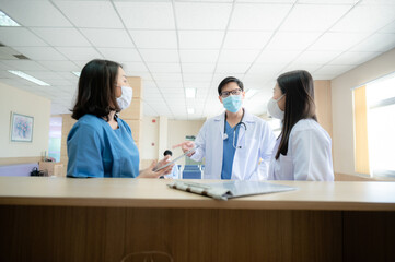 Fototapeta premium professional doctor and medicine person team have a conversation to talking in hospital about medical health care work, wearing surgical face mask