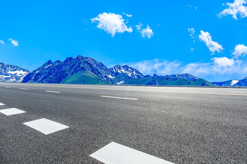 Asphalt road and mountain nature background.
