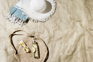 Summer vacation, beach rest concept, aesthetic flat lay fashion beach bag, white sun hat,...