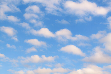 Background of fluffy cumulus clouds, slightly softened to enhance the soft impression