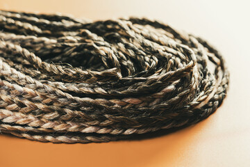 De braids made of natural hair. Fashionable youth hairstyle. Concept of beauty.