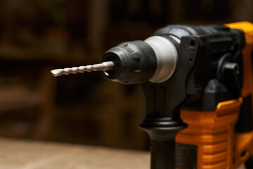 close-up and focus on the carbide tip of a drill bit inserted into a quick-change chuck