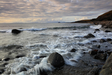 Fototapeta na wymiar Incoming tide at Duntulm Beach, Isle of Skye, Scotland, UK.