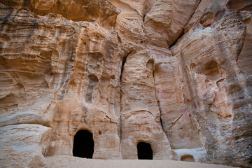 Carved building in the mountains in Little Petra, Jordan. Ancient nabateans remains. 