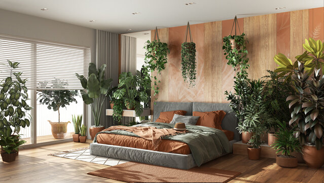 Urban jungle, modern bedroom in orange and wooden tones. Bed, parquet floor and big window, many houseplants. Home garden interior design. Biophilia concept