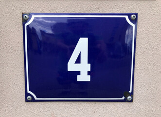 Blue metal sign with the number 4