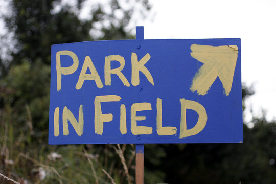 Sign painted white on blue 'park in field' - Catterline - Scotland - UK