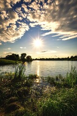Beautiful colorful landscape by the lake in the countryside. Sunset on the Mojcza lake near Kielce, Poland.