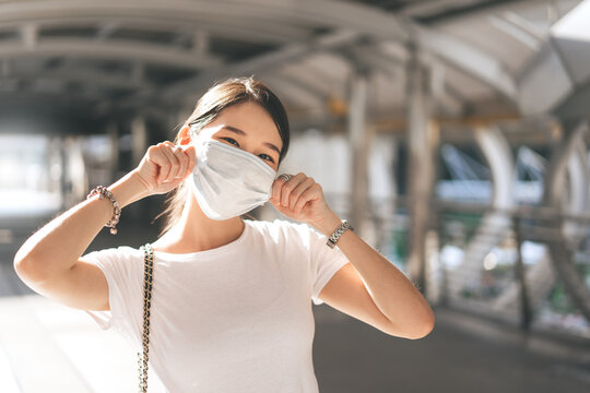 Young adult business southeast asian beautiful woman wearing face mask