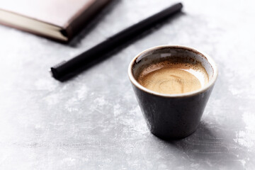 Cup of coffee on bright wooden background. Copy space	