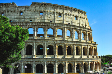 Section of, damaged, Roman Colosseum, against a clear, blue sky, in April