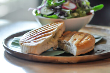 panini, italian sandwich and salad or ham and cheese sandwich
