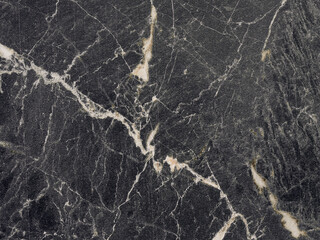 Fototapeta na wymiar Patterned nature of dark gray marble texture with beige stripes