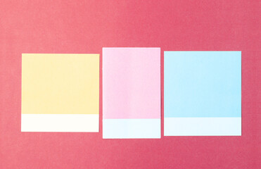 The 3 blank multi-colored post it notes on red background.