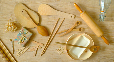 kitchen utensils from eco friendly materials on tablecloth made of compressed tree bark, recycling,...