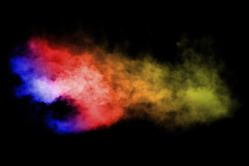 Color smoke from dry ice floating in the air, black background.