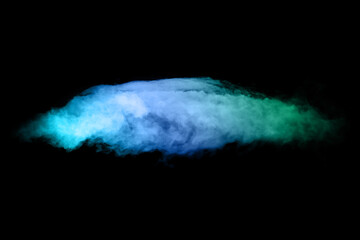 Color smoke from dry ice floating in the air, black background.