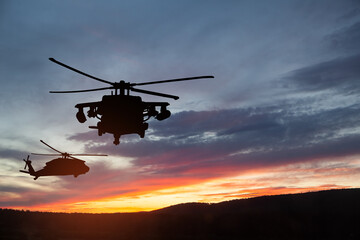Fototapeta na wymiar Silhouettes of helicopters on background of sunset. Greeting card for Veterans Day, Memorial Day, Air Force Day. USA celebration.
