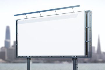 Obraz premium Blank white horizontal billboard on skyline background at daytime, perspective view. Mock up, advertising concept