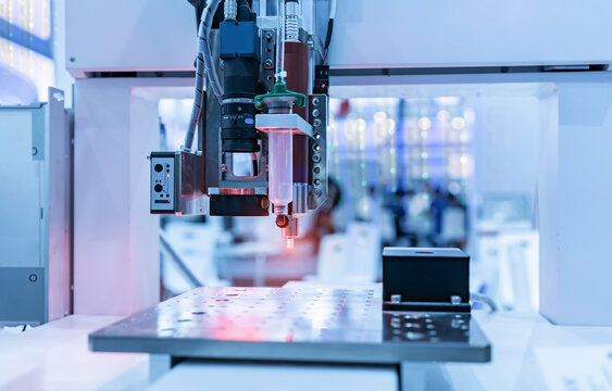 Robot holding glue syringe Injection with robotic machine vision system