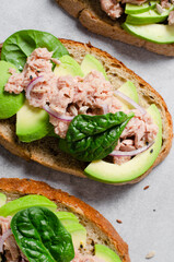 Tuna Avocado Toasts, Healthy Snack or Breakfast on Bright Background
