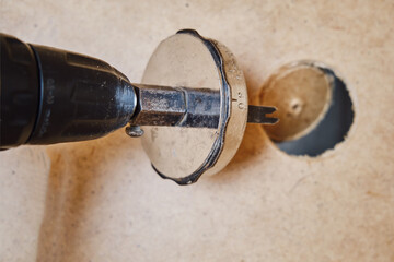 Drilling round holes with a crown on the drill bit. Sawing furniture with a circular saw with a...