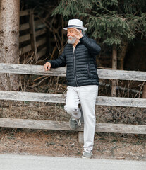 Portrait of a smiling, confident, handsome, mature man during his walk