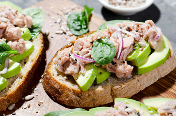 Tuna Avocado Toasts, Healthy Snack or Breakfast on Dark Background