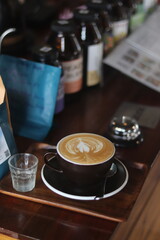 latte art on te wood table in the coffee shop