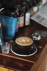 latte art on te wood table in the coffee shop
