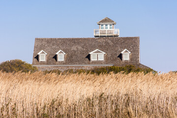 Deserted Oregon Inlet Life Saving Station with sea grass, Outer Banks, North Carolina