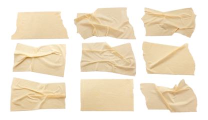 A set of crumpled strips of masking tape in various shapes and sizes. Masking tape isolated on white background