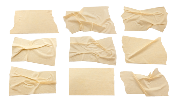 A set of crumpled strips of masking tape in various shapes and sizes. Masking tape isolated on white background