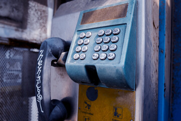Old and dirty street phones at the city landfill