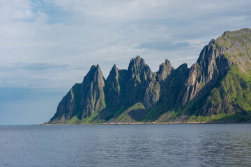 The crystal clear water of the Ersfjordstranda beach in Senja Island,  Norway