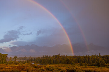 Fototapeta na wymiar Autumn Landscape in the Tetons in a Storm with Rainbow