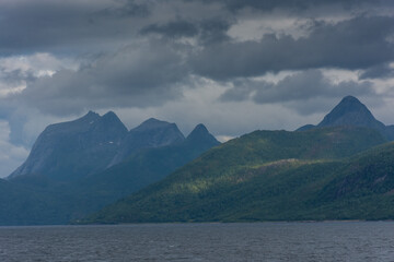 Fototapeta na wymiar Beautiful view over a Norwegian fjord from the sea