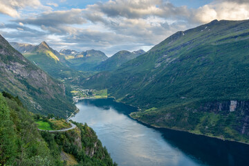 Fototapeta na wymiar Sunset over the Geirangerfjord and the Seven Sisters Waterfall, Norway