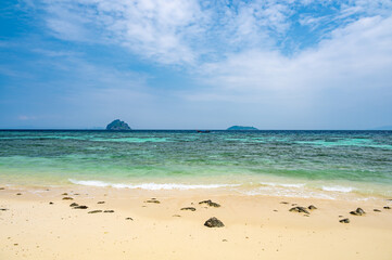 View of beautiful tropic beach at Ko Phi Phi islands, Thailand. White sand with green forest, palms...