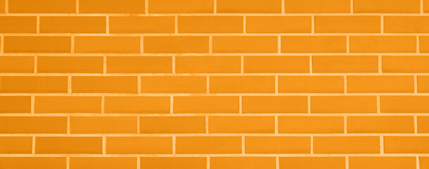 Texture of bright orange brick wall as background, banner design