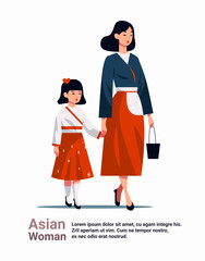 mother and little children standing together asian mom taking daughter to school or kindergarten motherhood happy family
